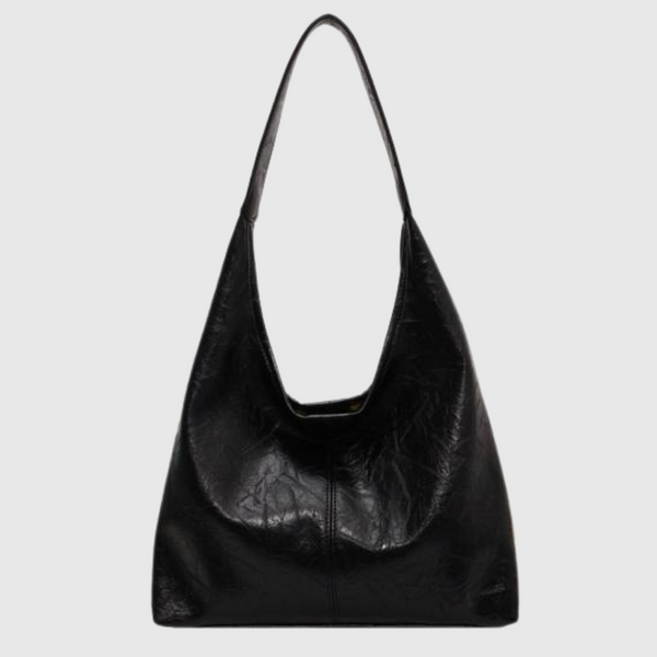 Röd rymlig axelväska för dam. Elegant handväska, idealisk arbetsväska och modeaccessoar.