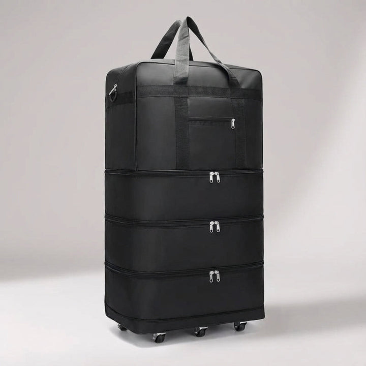 Grön fällbar weekendväska/trolley med hjul, expanderbar för extra bagage och lätt transport.