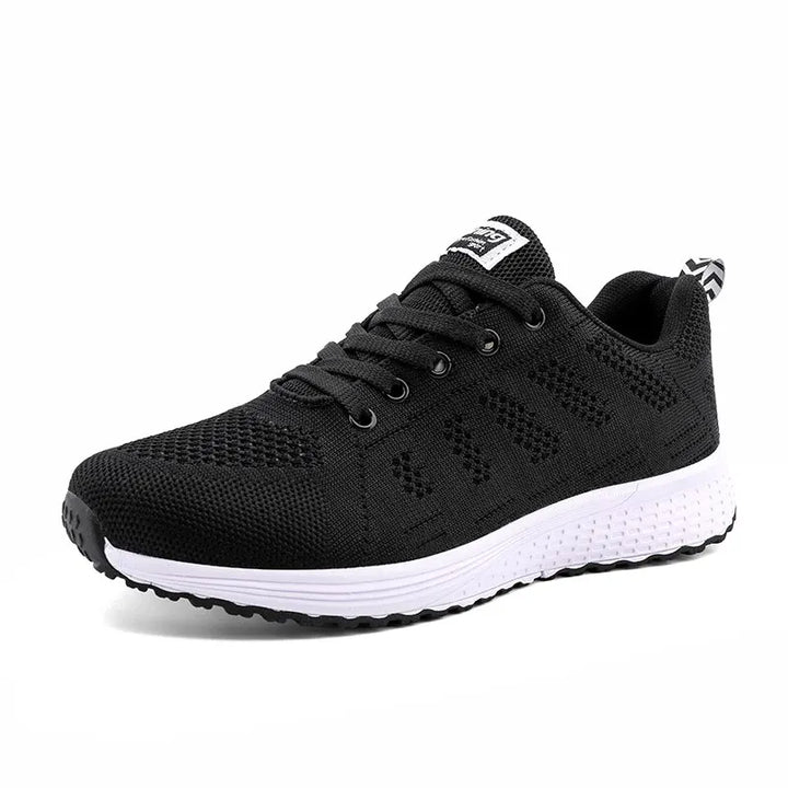 Grå lätta sneakers för kvinnor. Flexibla andningsbara promenadskor med antihalksula för komfort.