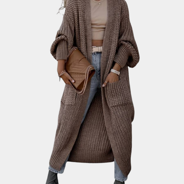 Elegant och bekväm damjacka, lång modell. En tidlös vinterjacka i bred passform för kyliga dagar.