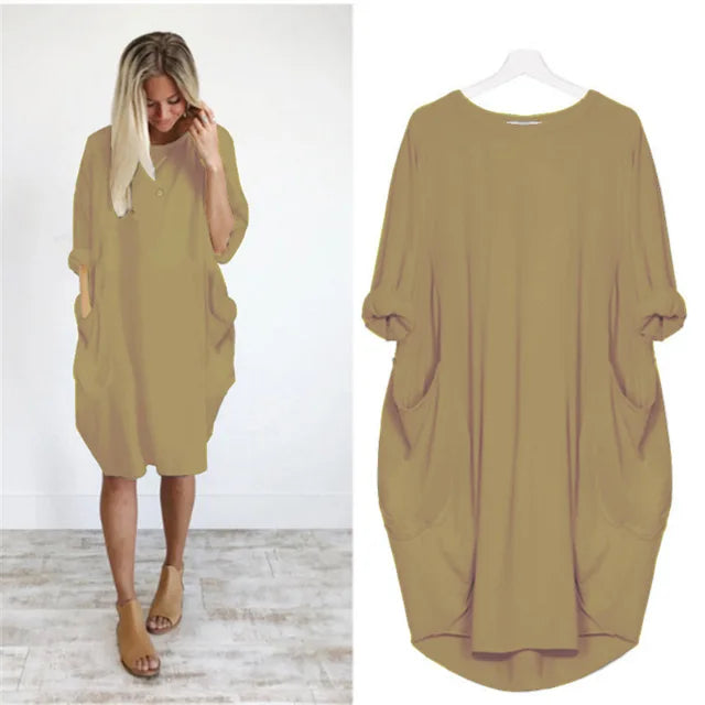 Bekväm ljusgrå oversized damklänning. Rund halsringning och löst sittande design för ultimat avkoppling.