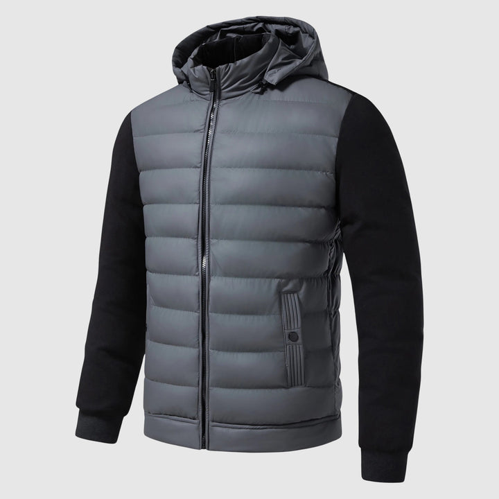 Stilren quiltad herrjacka med huva. En modern vinterjacka som ger skön värme och urban look i kylan.