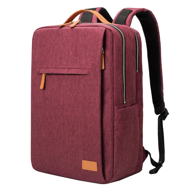 Röd unisex reseryggsäck med vadderat laptopfack och USB-laddningsport. Håll dig uppkopplad på språng.