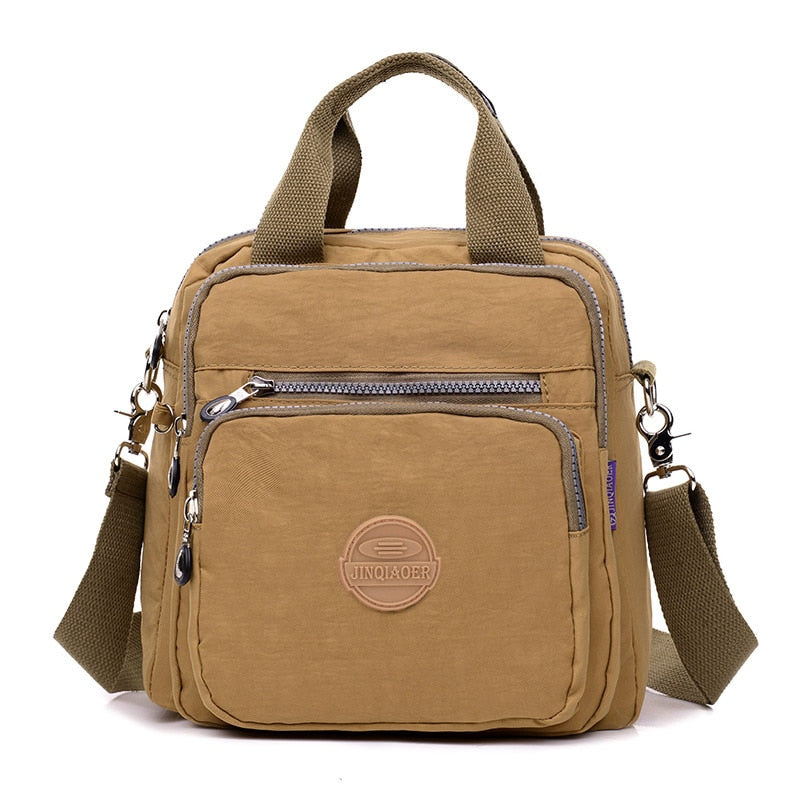 Beige vattentålig nylonväska. Dam Casual Crossbody väska som är både multifunktionell och stilren.