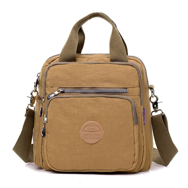 Beige vattentålig nylonväska. Dam Casual Crossbody väska som är både multifunktionell och stilren.