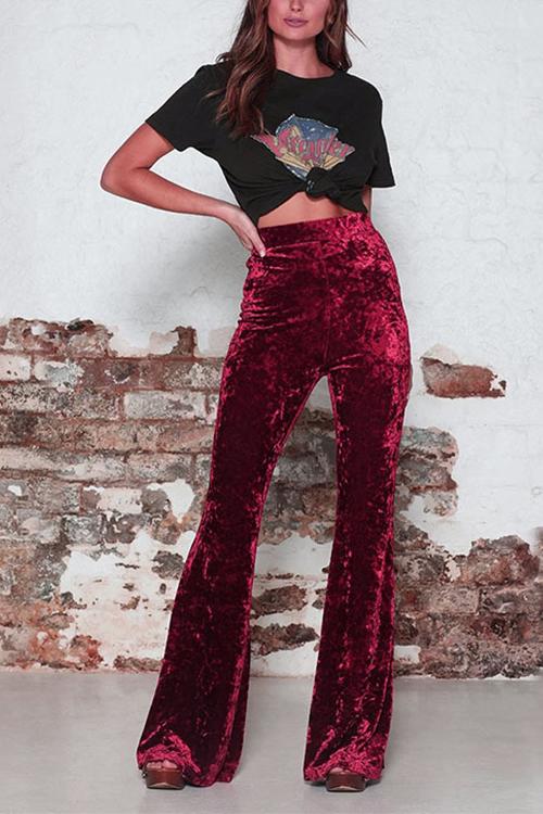 Röda elastiska bell bottoms med hög midja, smickrar figuren, festbyxor.