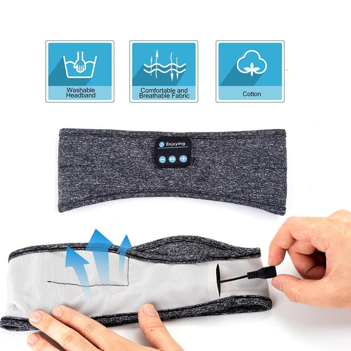 Trådlöst Bluetooth sportpannband, mörkgrått, med kontroller synliga på sidan, för musik och samtal.