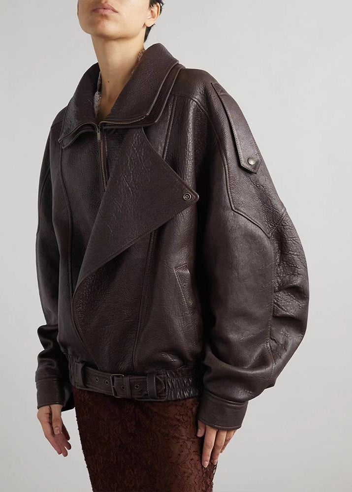 Stilren damjacka: Kvinnors oversized bomberjacka med bälte. Idealisk för casual eller festlig look.