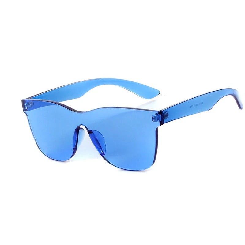 Somriga fyrkantiga solglasögon utan båge, UV400-skydd. Godisfärgade damaccessoarer för trendig look.