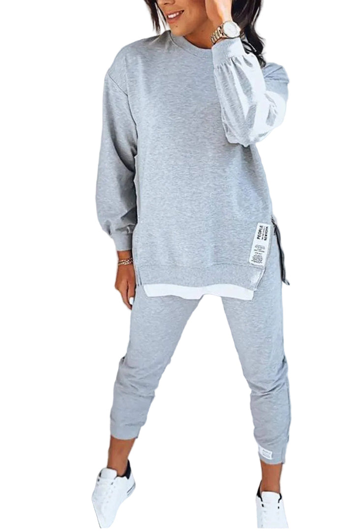 Trendigt och bekvämt set för kvinnor med sweatshirt och matchande byxor. Perfekt för avslappnad vardagslook.