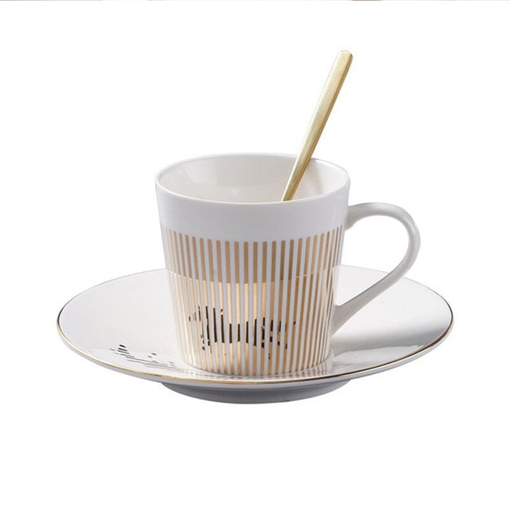 Unisex keramik kaffekopp och fat set med gulddetaljer och animerad design, 300ml.