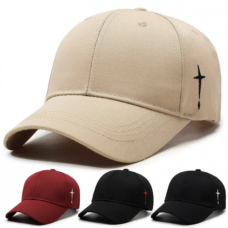 Stilren unisex baseballkeps med broderad crossdetalj. Perfekt huvudbonad för soliga dagar och fritid.