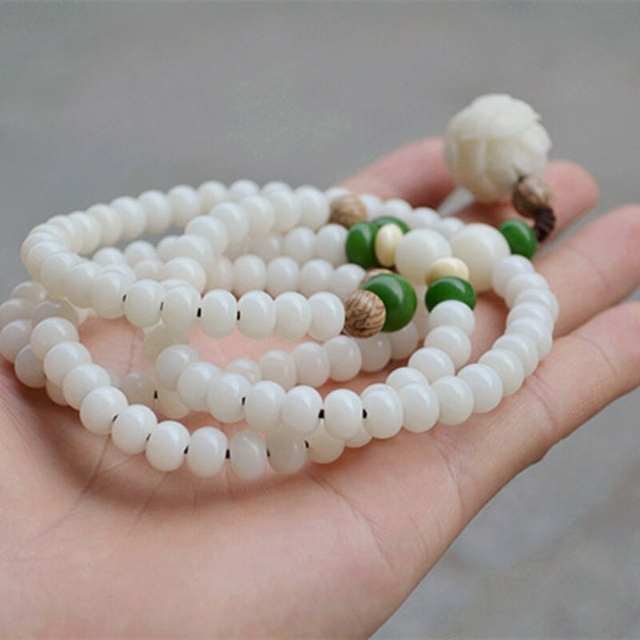 Unisex smyckesarmband med äkta bodhipärlor & lotusblomma. Idealiskt för meditation, yoga & andlig balans.