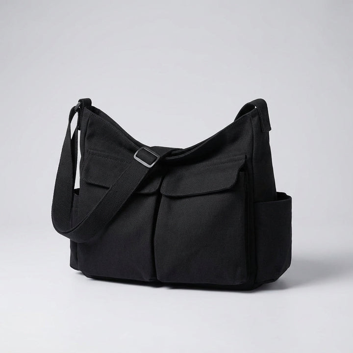 Modern unisex canvas axelväska, stilren och funktionell. Perfekt crossbody-messengerväska för organiserad förvaring.