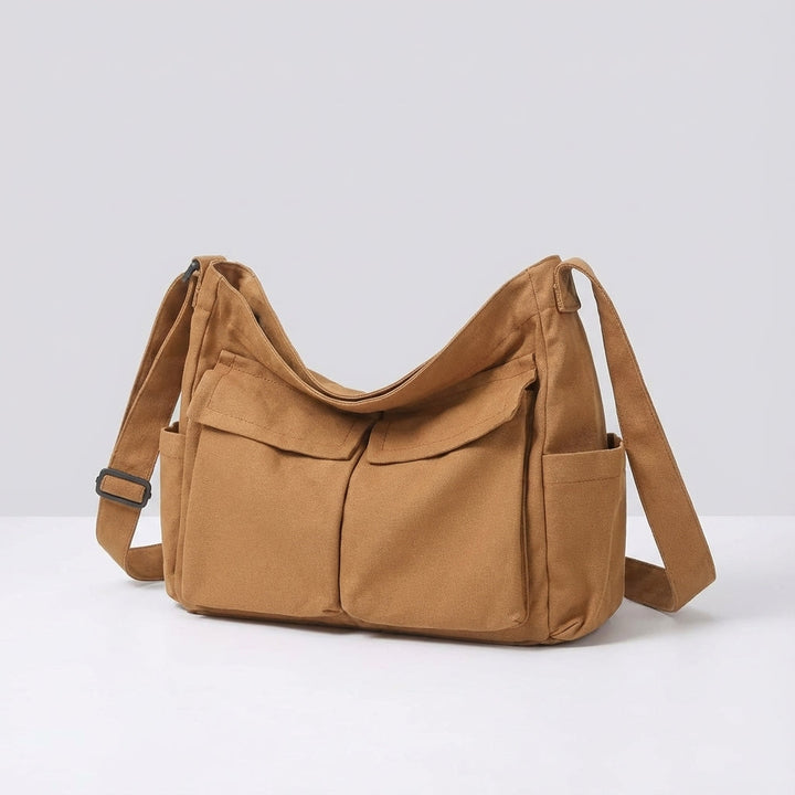 Mångsidig canvasväska, unisex crossbody design. Slitstark och organiserad vardags-messenger för arbete och fritid.