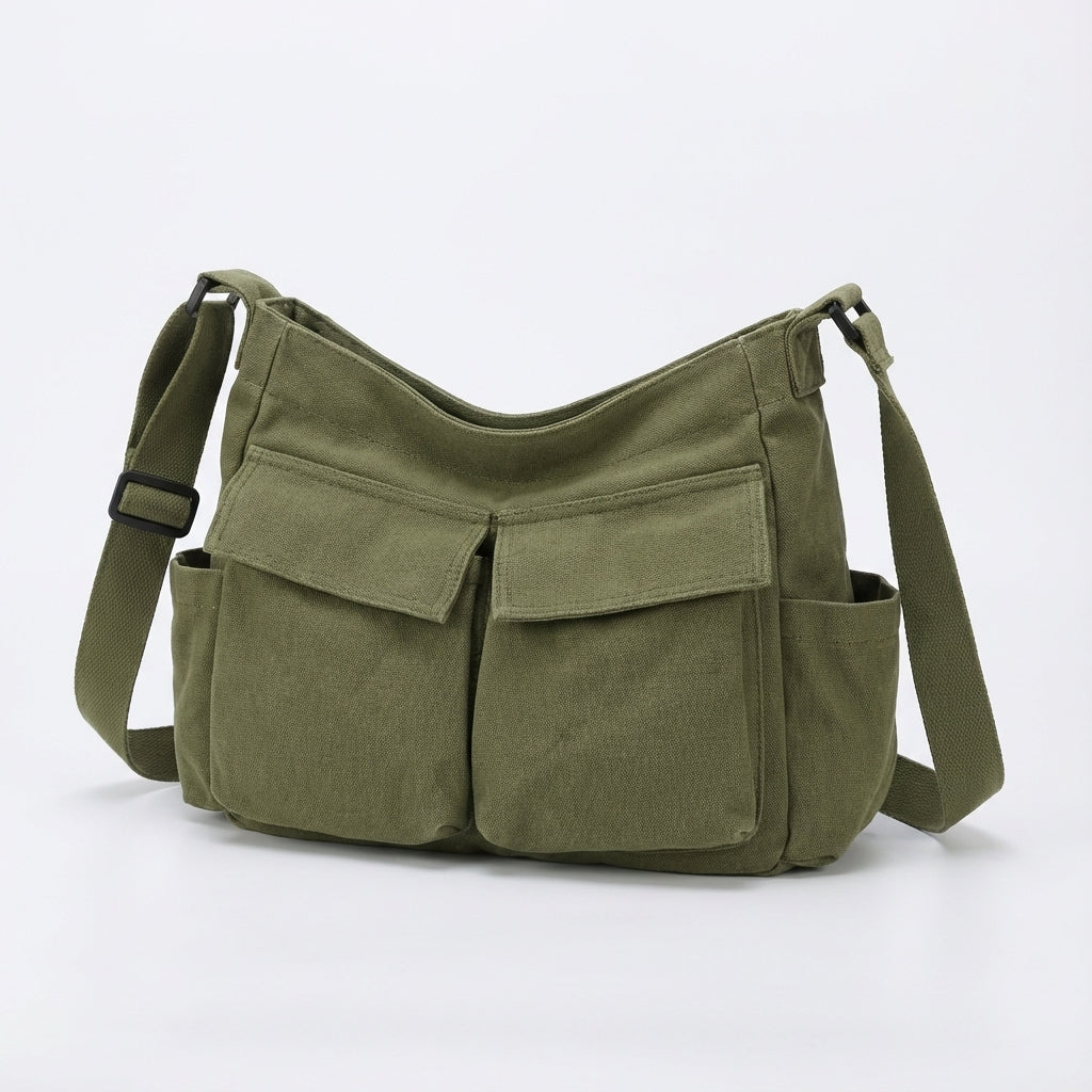 Elegant canvas crossbody för män och kvinnor. Stilren unisex axelväska, en praktisk och rymlig messengerväska.