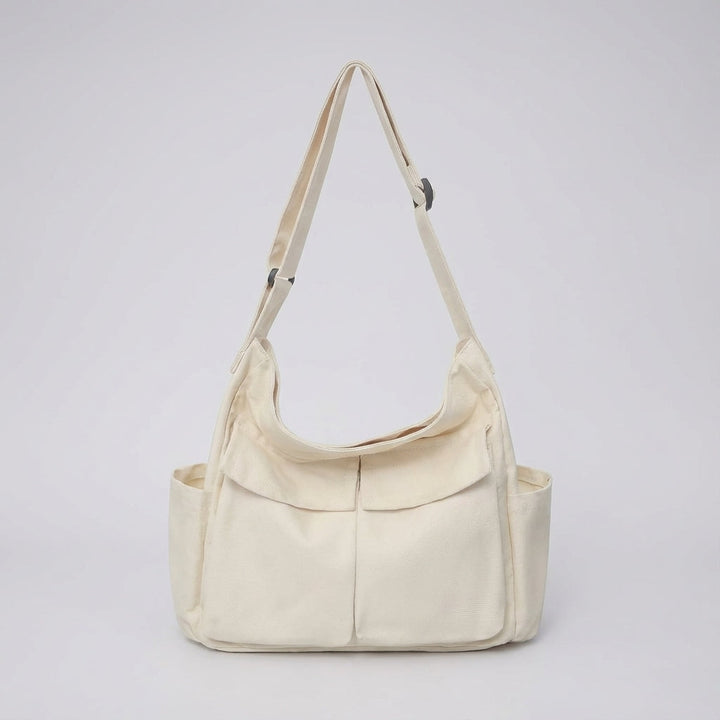 Daglig unisex canvas messengerväska. Tålig crossbody för att organisera dina prylar, perfekt som stilren axelväska.