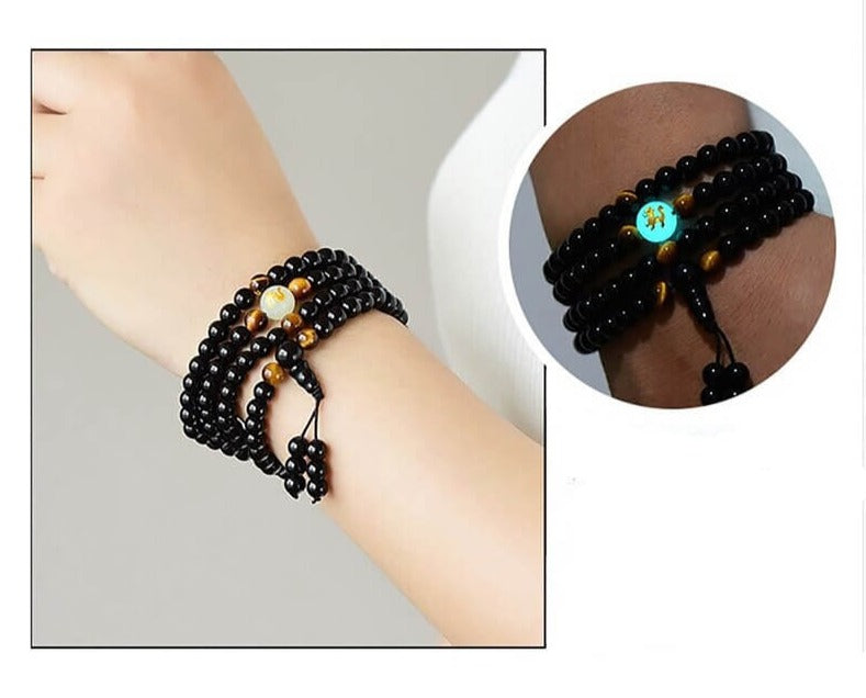 Herrsmycke: Kraftfullt drakarmband i svart obsidian. Symboliserar skydd och andlig styrka och energi.