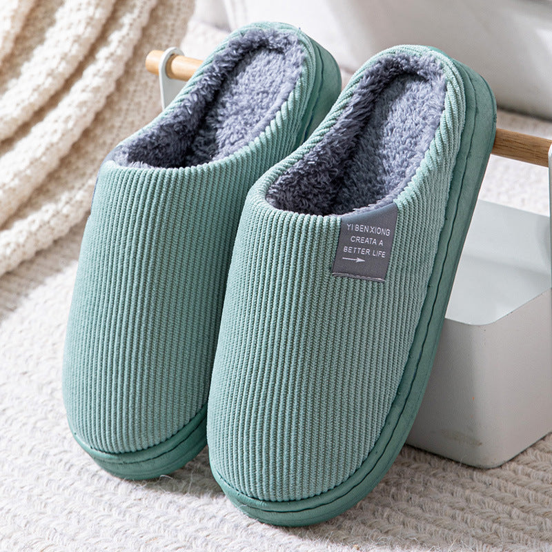 Unisex-tofflor för inomhusbruk, termiska och bekväma, med mjuk, halkfri sula på trägolv.