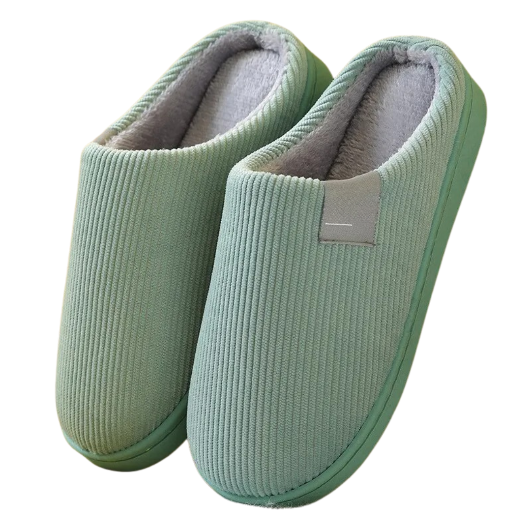 Unisex innetofflor i svart med mjuk, halkfri sula, perfekta för att hålla fötterna varma.