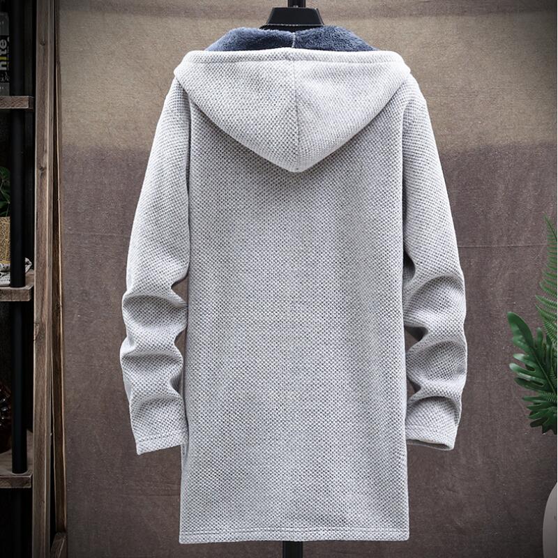 Stilren oversized huvtröja med full dragkedja. Unisex design för vardagsbruk och vintermode.