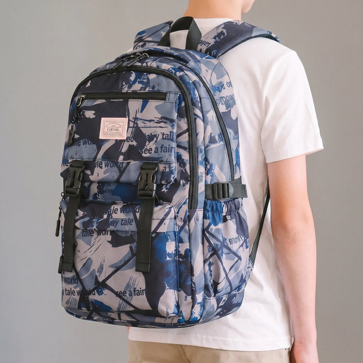 Unisex skolryggsäck med färgglatt abstrakt tryck, perfekt för skolstart och organiserade skolmaterial.