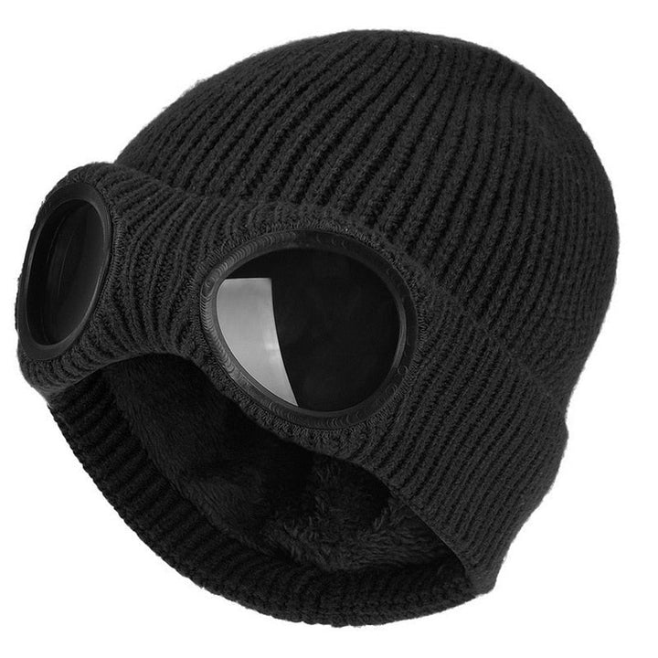 Varm, stickad mössa i akryl med inbyggda uppfällbara goggles, perfekt för skidåkning
