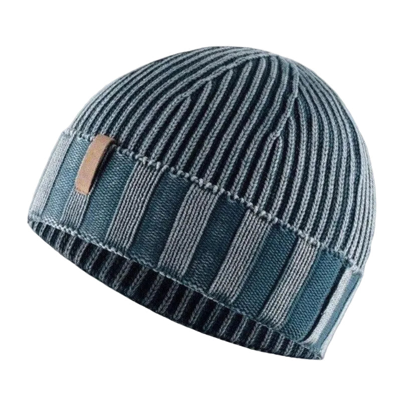 Unisex stickad mössa med retrokänsla för vinter. Varm och stilfull beanie, perfekt för kalla dagar & streetwear.