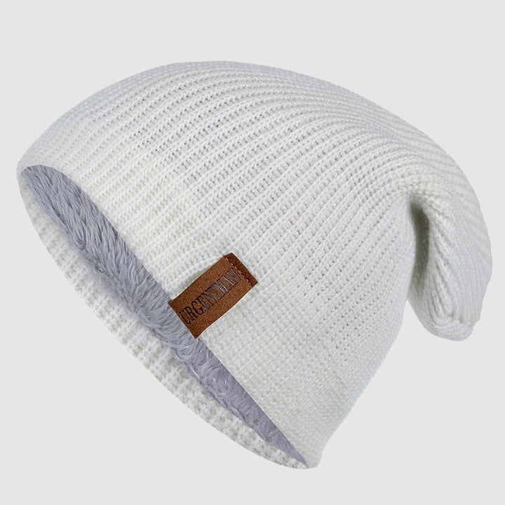 Varm stickad unisex vintermössa med mjukt fleecefoder, idealisk för kalla dagar och utomhusaktiviteter.