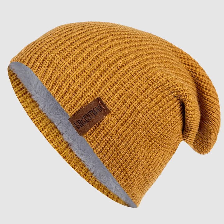 Mysig unisex stickad mössa med fleecefoder, designad för att ge maximal värme och komfort under vintern.
