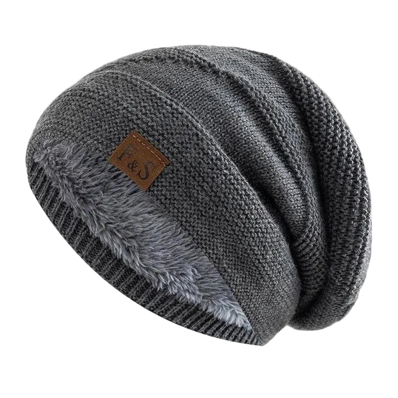 Unisex stickad mössa med varmt, mjukt fleecfoder. Perfekt vintermössa för komfort och stil i kylan.