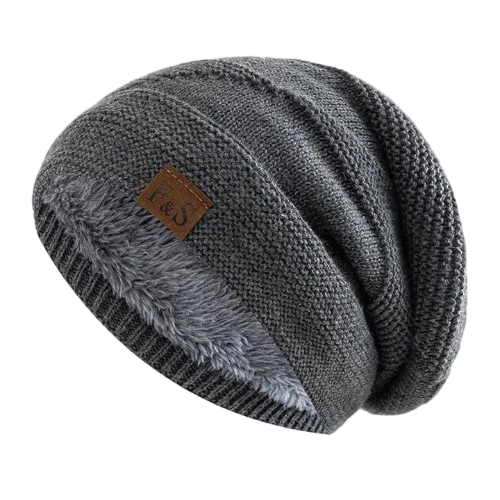 Unisex stickad mössa med varmt, mjukt fleecfoder. Perfekt vintermössa för komfort och stil i kylan.