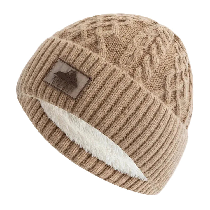 Unisex stickad mössa med vikbar mudd, perfekt för vinter och kallt väder. Varm och stilren huvudbonad.