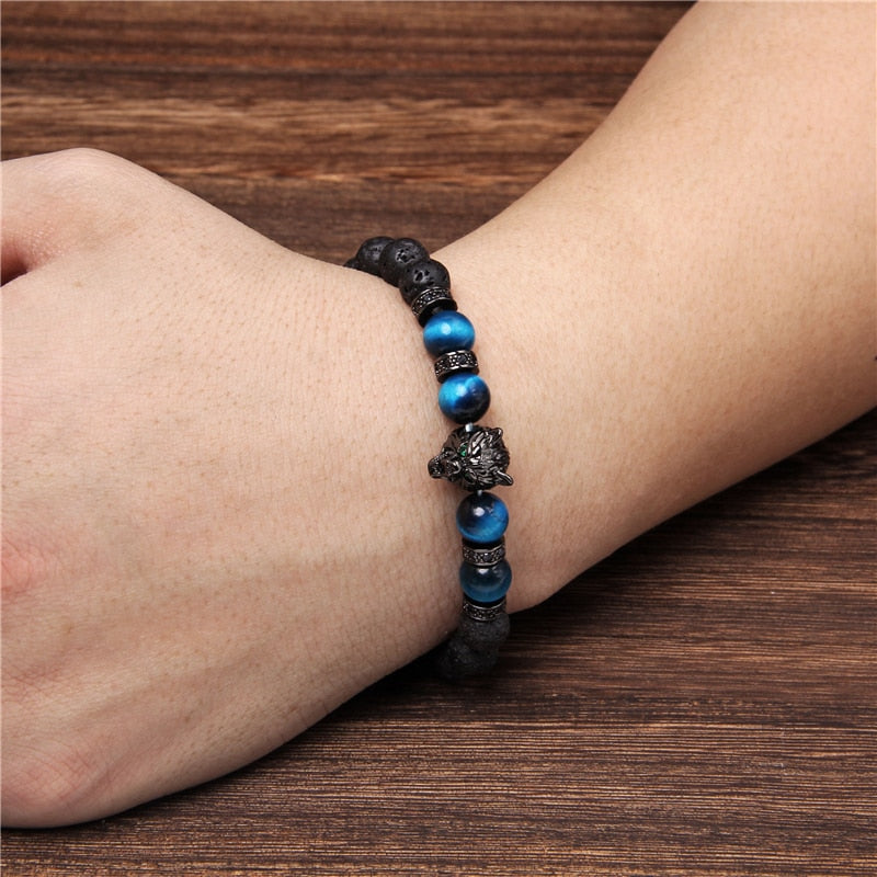 Tigeröga armband för unisex med vargmotiv. Stärker lojalitet, styrka och ger energi. Ett meningsfullt smycke.