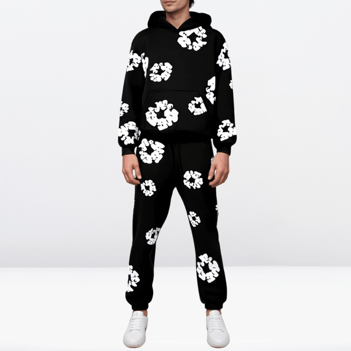 Detaljbild av tyg och sömmar på den bekväma unisex träningsoverallen. Högkvalitativa fritidskläder för alla.