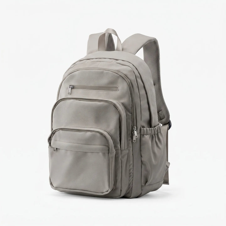 Snygg unisex skolryggsäck med modern design, vattentålig nylon och smarta förvaringslösningar framtill.