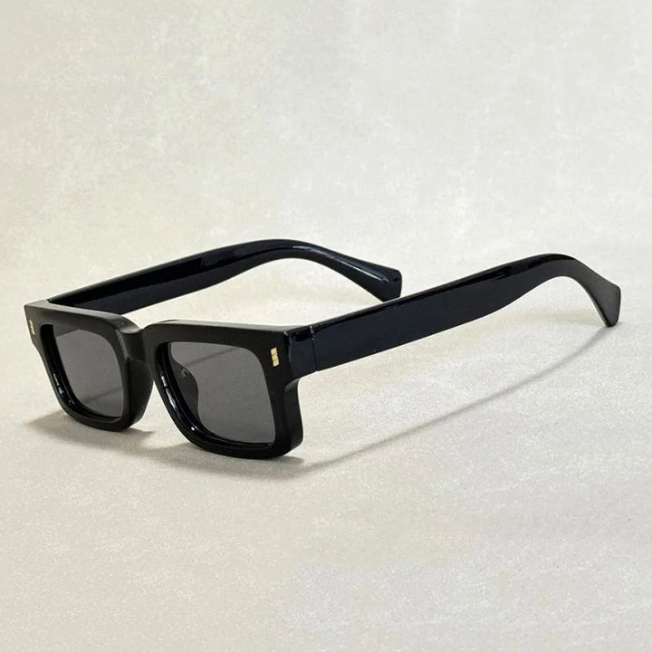 Trendiga unisex solglasögon med ikonisk djärv ram för modeaccessoar och UV400-skydd.