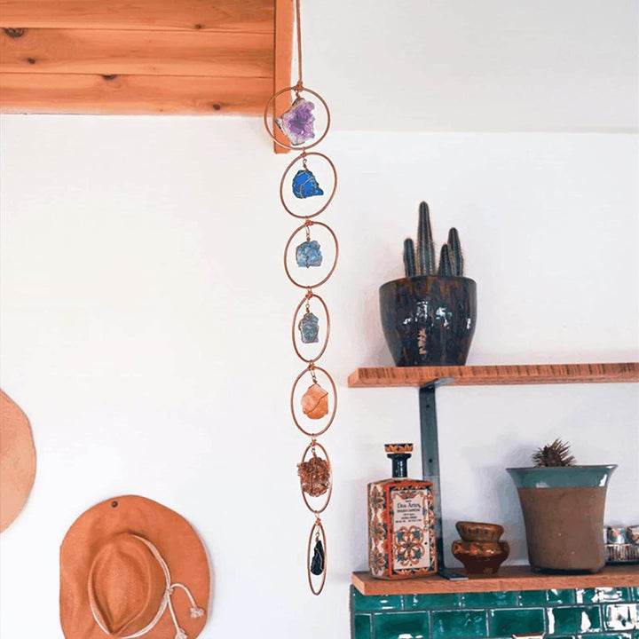 Väggdekor med 7 chakra ädelstenar för wellness och inre frid. Perfekt för att skapa en lugn oas.