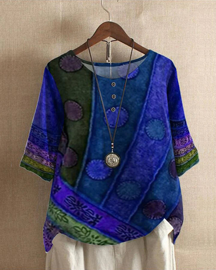 Graciös löst sittande damtopp i vintage design, tillverkad av lättviktig polyester.