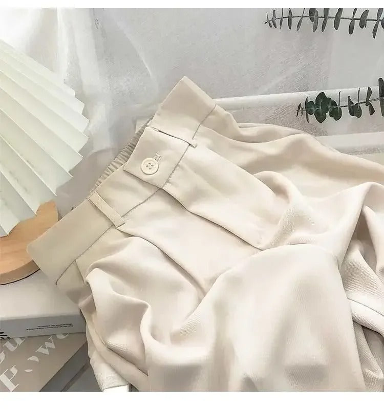 Ankelbyxor för kvinnor med hög midja och raka ben, tillverkade i mjuk polyester.