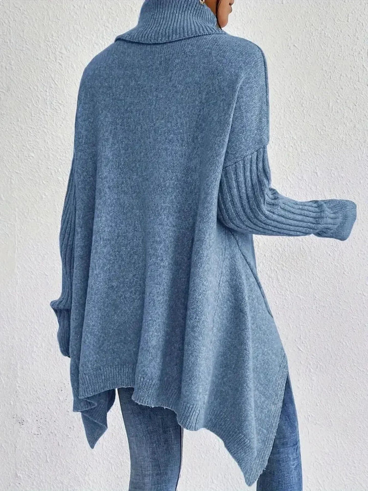 Mysig överdimensionerad damtröja med ribbade ärmar och asymmetrisk fåll, idealisk för höstmode och komfort.