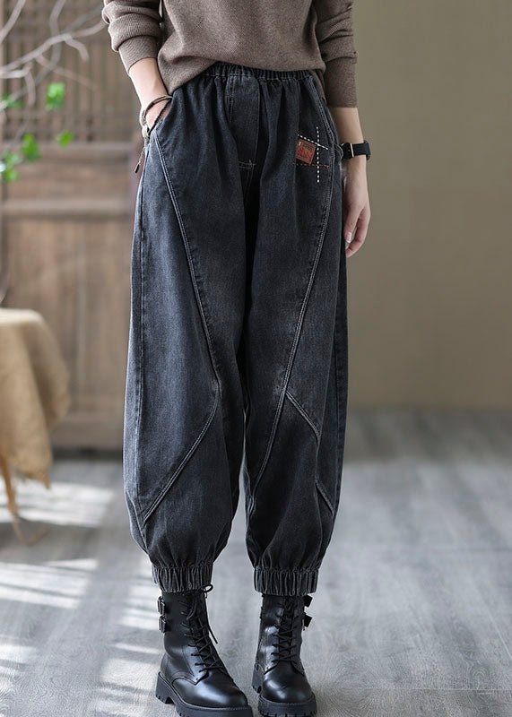 Svarta dambyxor i denimstil med resår i midjan och avslappnad passform, vintage mode