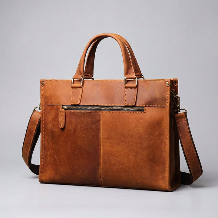 Unisex arbetsväska för laptop upp till 16 tum. Mörkbrun läderdesign, perfekt som pendlarväska.