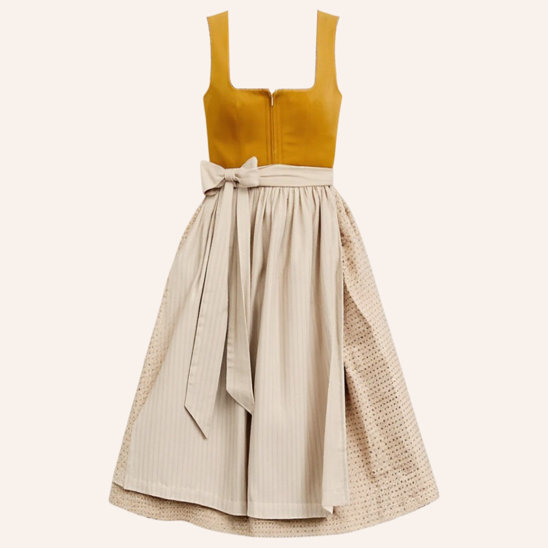 Traditionell bayersk orange Dirndl festklänning för kvinnor i vintage stil med elegant beigefärgad schürze.