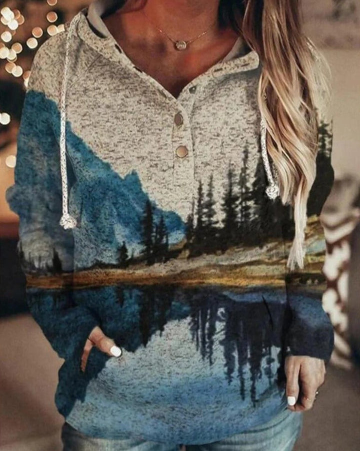 Mode damtröja med avslappnad passform, vit med bergstryck och tie-dye mönster. Långärmad.