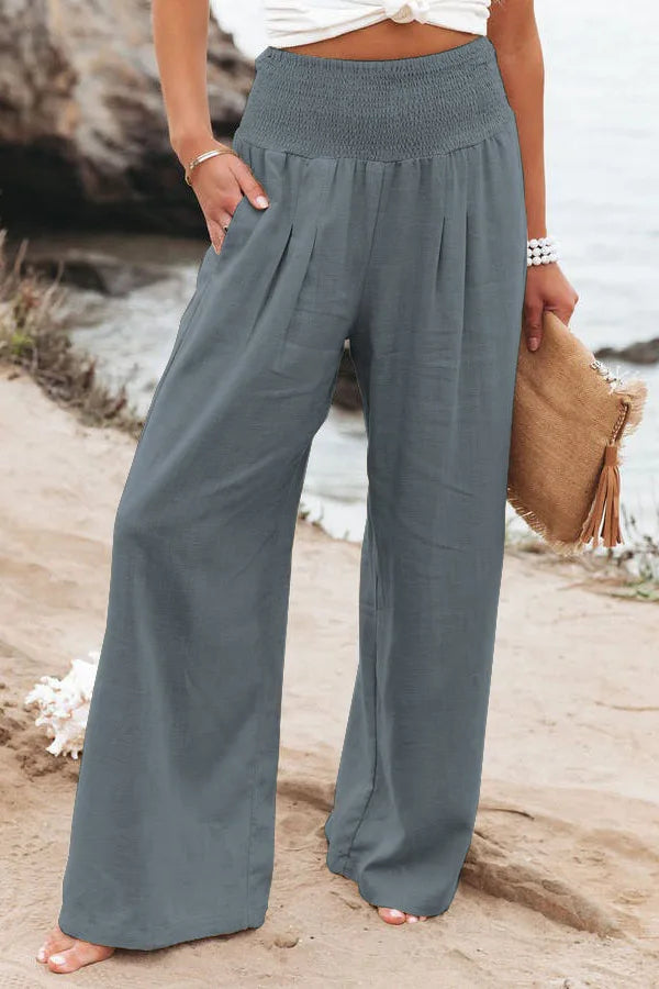 Fashionabla dambyxor med vida ben och elastisk midja, stilren sommarlook för kvinnor.