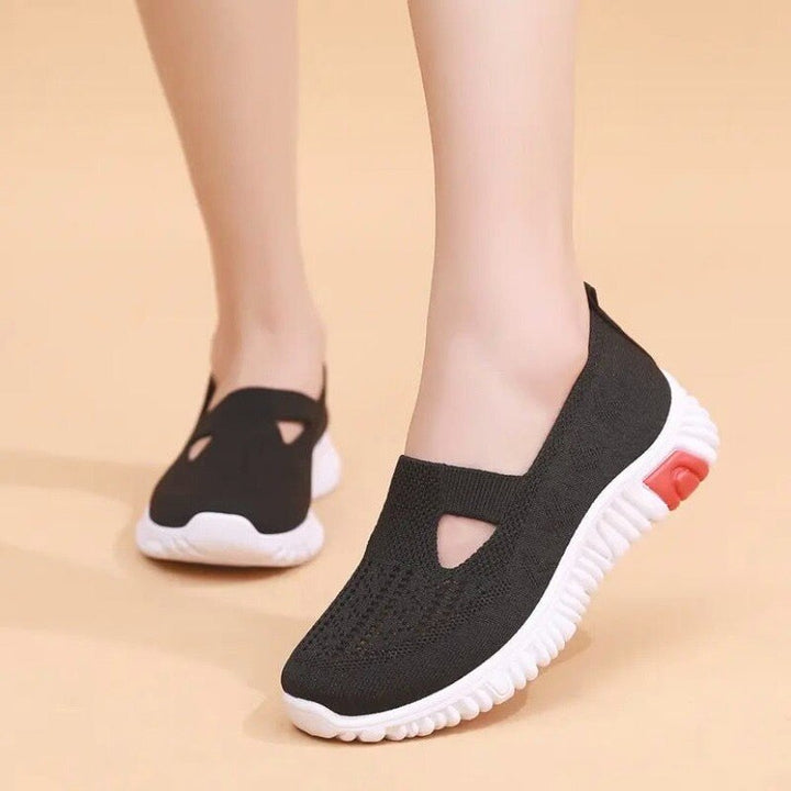 Eleganta svarta damsneakers i canvas, bekväma och mångsidiga fritidsskor.