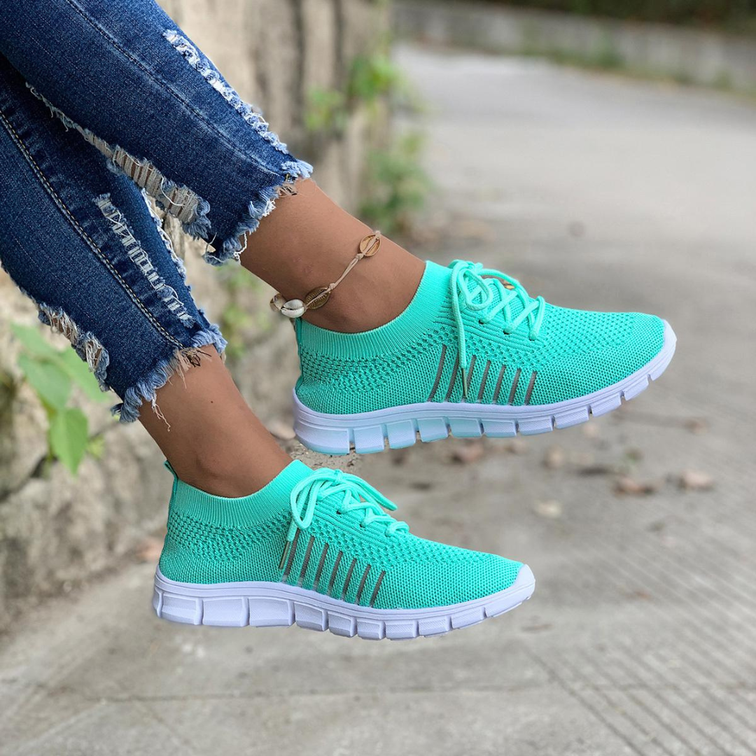 Mörkgrå damsneakers med mjuk sula, sportig stil och andningsbara för optimal komfort.