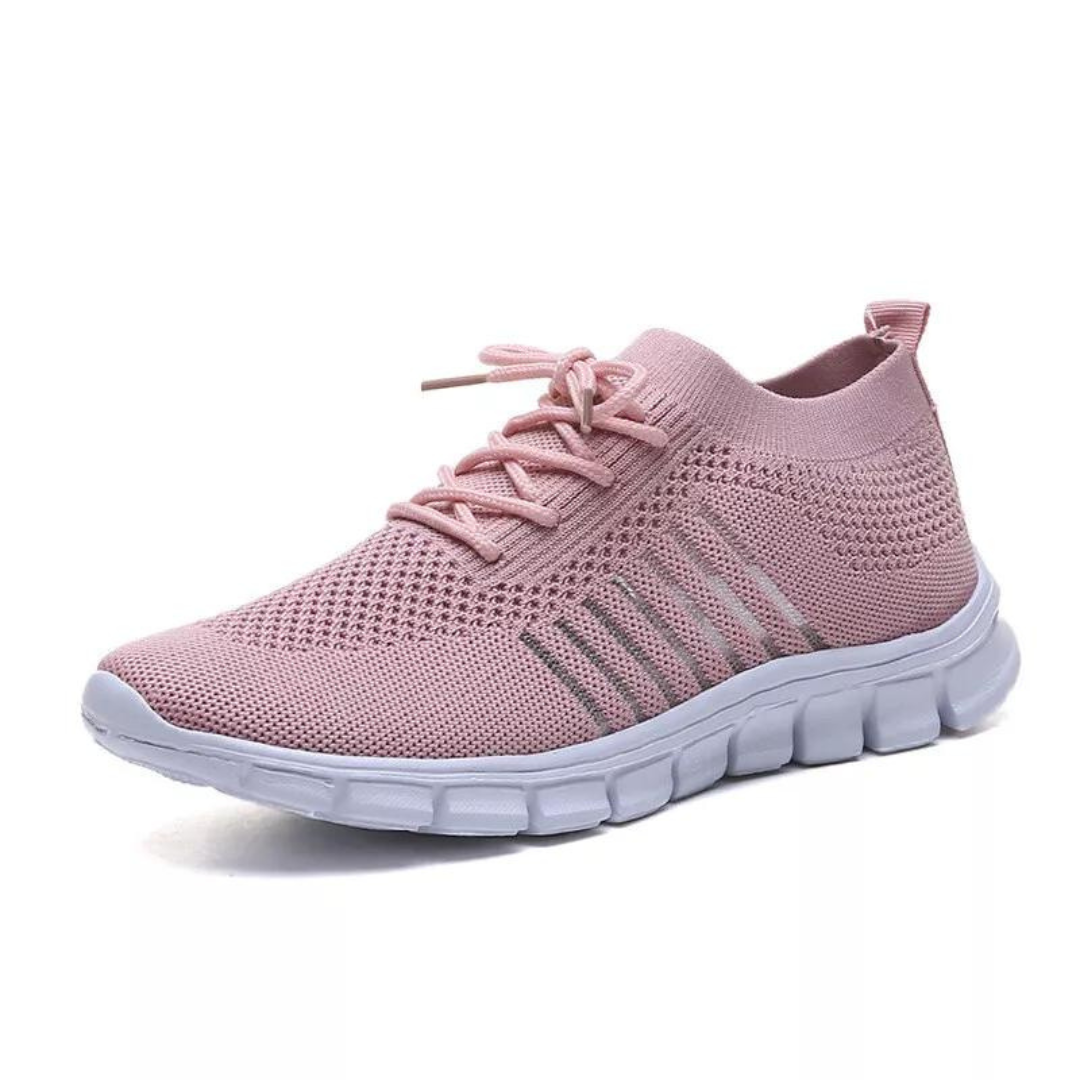 Grå damsneakers med andningsbart tyg och stötdämpande sula för optimal komfort.